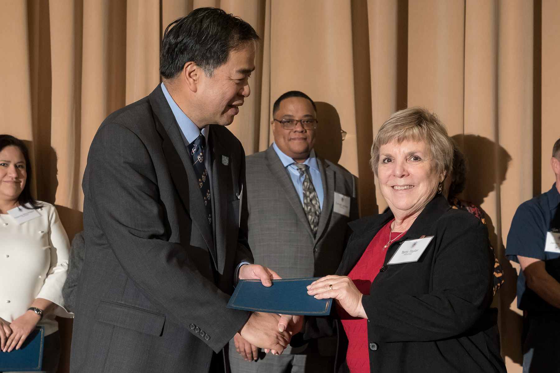 Terry Taylor, right, with A. Gabriel Esteban, Ph.D., president, as faculty and staff members are inducted into DePaul University's 25 Year Club, Tuesday, Nov. 13, 2018, at the Lincoln Park Student Center. Employees celebrating their 25th work anniversary were honored at the luncheon with their colleagues and will have their names added to plaques located on the Loop and Lincoln Park Campuses. (DePaul University/Jeff Carrion)